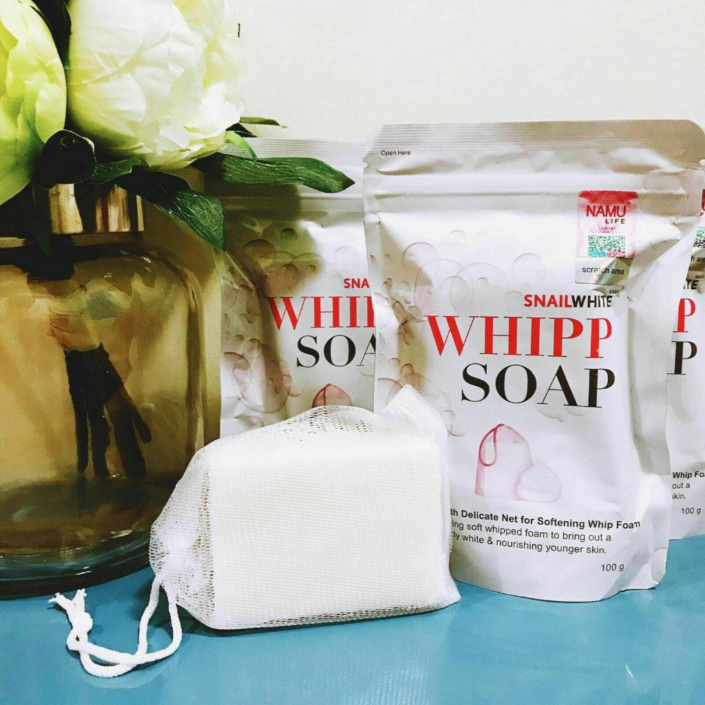 Snail White Whipp Soap bar with delicate net displayed beside product packs