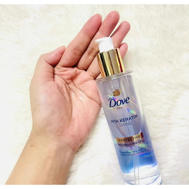 Dove Hya Keratin Oil held in hand showing size and design