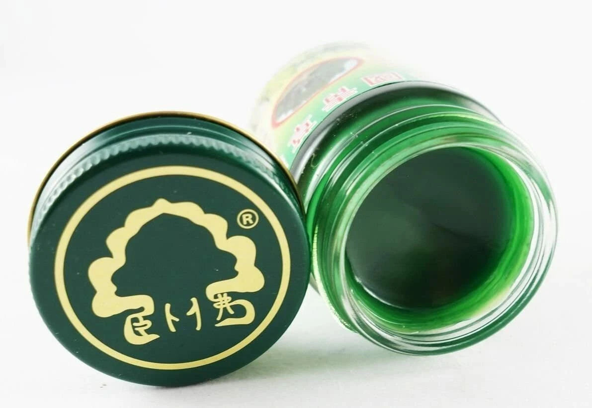 Bottom lid design of Phoyok balm with gold print elephant logo