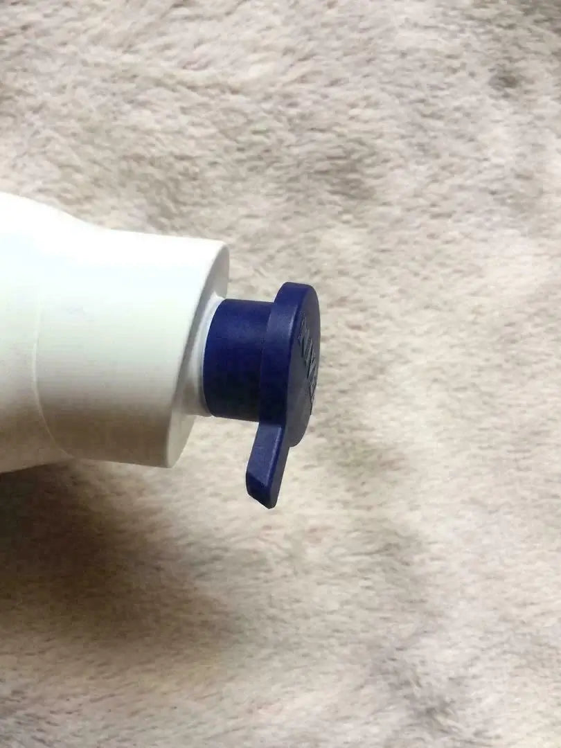 NIVEA Body Lotion Extra Bright Radiant and Smooth bottle pump top close-up