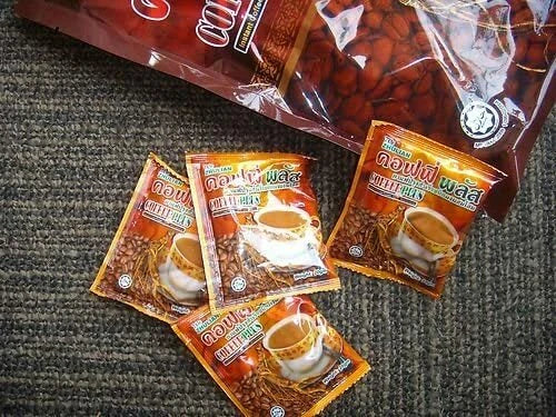 Zhulian Coffee Plus single-serve sachets of instant ginseng coffee displayed on table