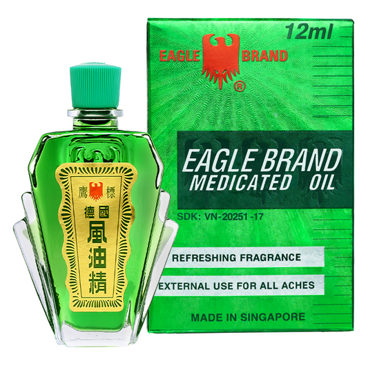 Eagle Brand Medicated Oil 12ml in green glass bottle with box, external use for pain relief, made in Singapore.