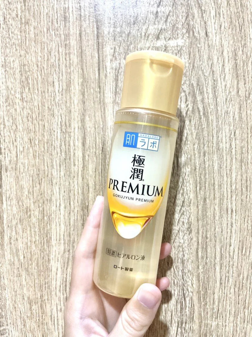 Hada Labo Premium Lotion Gokujyun 30ml bottle held in hand natural lighting