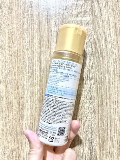 Hada Labo Premium Lotion Gokujyun 30ml bottle held in hand natural indoor lighting