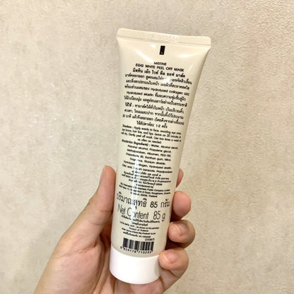 Mistine Egg White Peel Off Mask 85g tube held in hand front view