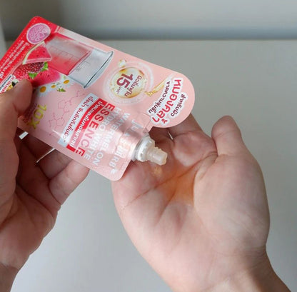 Jula's Herb Watermelon Essence 6x15g packet being poured onto hand, showcasing the hydrating facial serum.