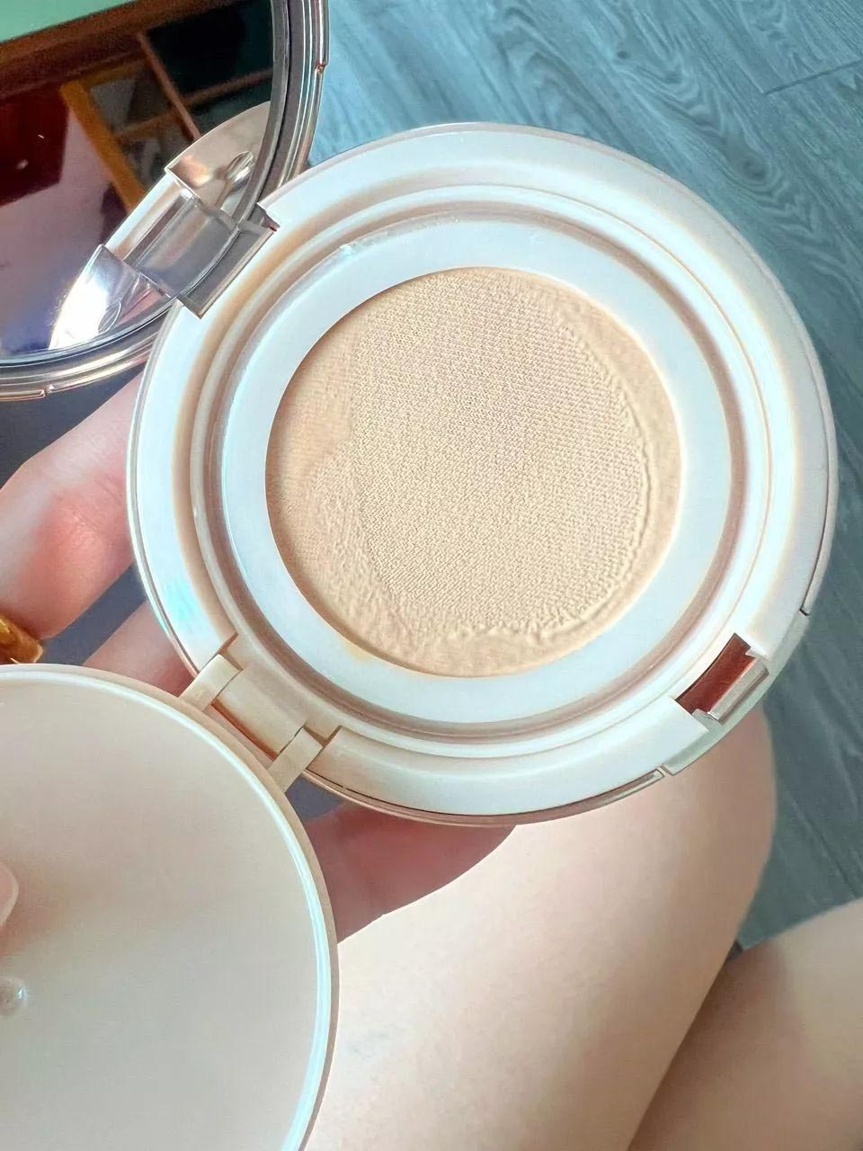 Aura Rich Cushion refill sponge inside compact close up view