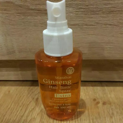 Wanthai Ginseng Hair Tonic Spray 100ml bottle with pump dispenser on wooden surface
