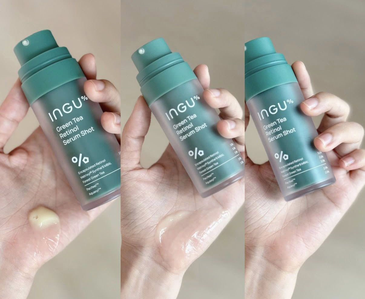 Hands holding multiple bottles of INGU Retinol Serum Shot to display size and texture