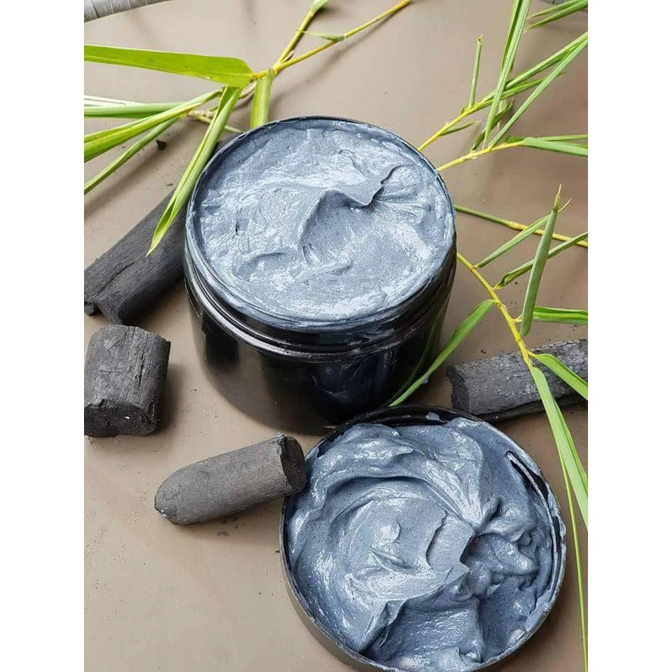 Hiso Keratin Treatment creamy hair mask texture displayed with charcoal and stones