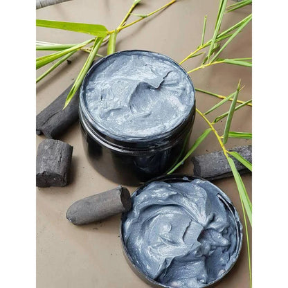 Hiso Keratin Treatment creamy hair mask texture displayed with charcoal and stones