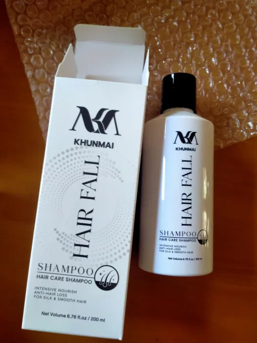 KHUNMAI Hair Fall Shampoo bottle with box on wooden table
