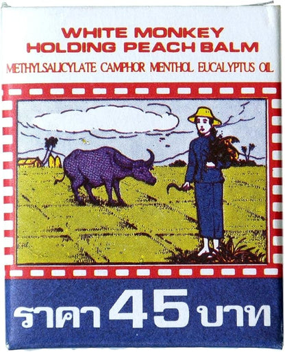 White Monkey Balm box packaging with illustration of man and buffalo traditional Thai design