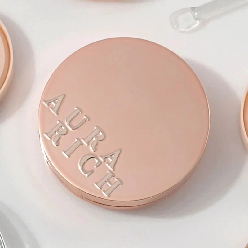 Aura Rich Cushion compact case top view with logo detail