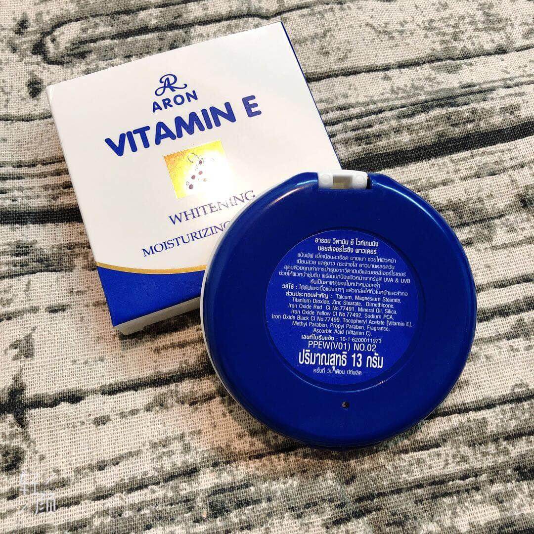 Back of ARON Vitamin E Face Powder blue compact case with product label and packaging box