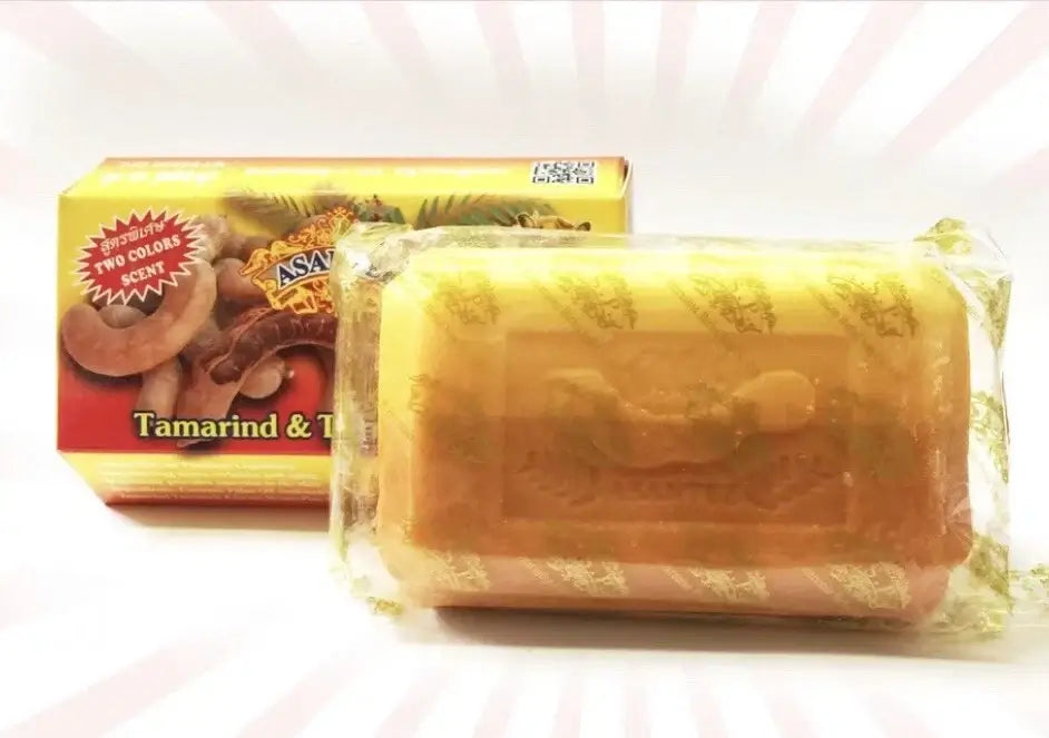 Asantee Tamarind Soap bar wrapped in clear plastic next to its packaging box.
