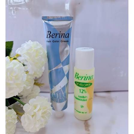 Berina A18 Hair Color Cream with developer bottle and white flowers, showcasing vibrant hair dye products.