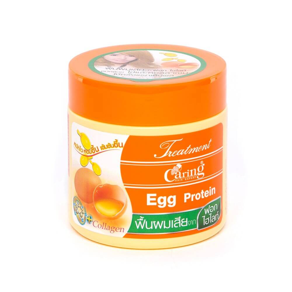 Front view of Caring Egg Protein Treatment 250ml medium hair mask jar with orange lid