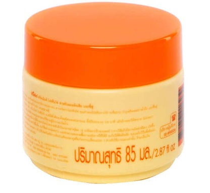 Close-up of the back label on Caring Egg Protein Treatment hair mask packaging with Thai and English instructions