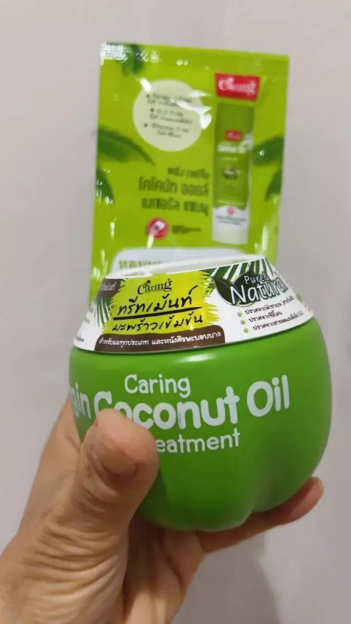 Caring Virgin Coconut Oil Hair Mask packaging with treatment sachet, showcasing a green container for hair care.