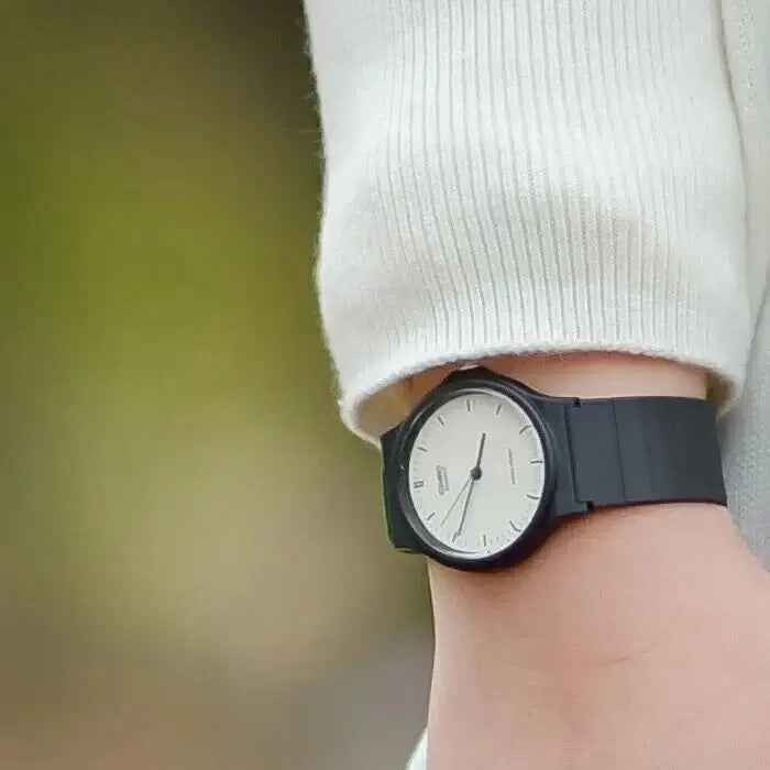 Casio MQ-24-7ELDF Watch displayed on wrist showcasing black resin band and white dial.