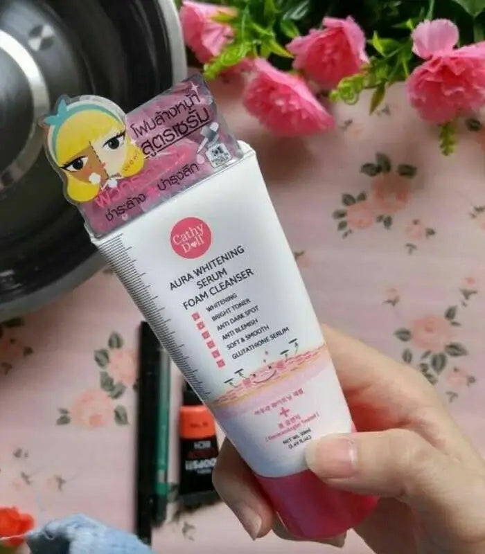 Cathy Doll Aura Serum Foam Facial Cleanser 100ml Tube Lifestyle Display with Flowers