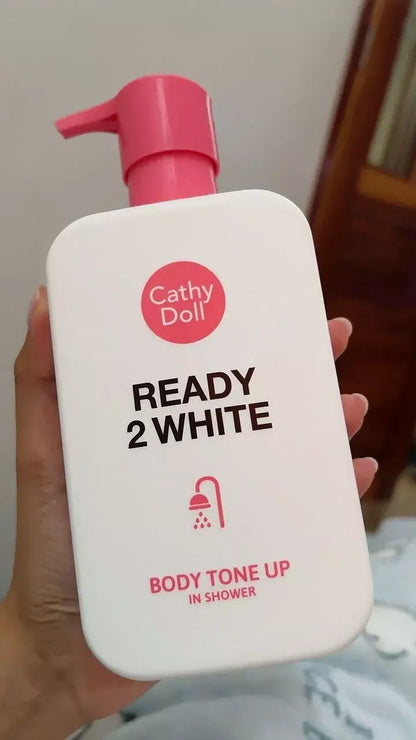 Cathy Doll Ready 2 White Body Tone Up In Shower Cream bottle held in hand showing front label