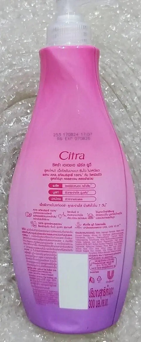 Back side view of Citra AHA Pearl UV Lotion pink bottle showing ingredients and details