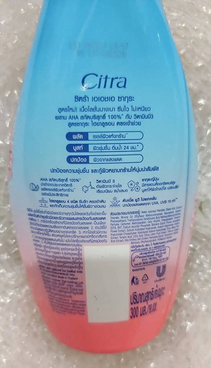 Citra AHA Sakura Lotion packaging showcasing UV defense and moisturizing benefits, ideal for enhancing skin hydration.