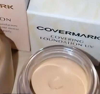 Covermark Foundation UV JQ creamy texture in jar beside Covermark packaging, showcasing high coverage waterproof foundation.