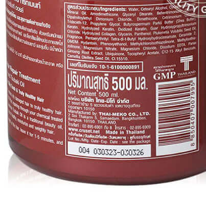 Macro view of the barcode, registration number, and manufacturing details on the lower portion of the Cruset Keratin Complex jar.