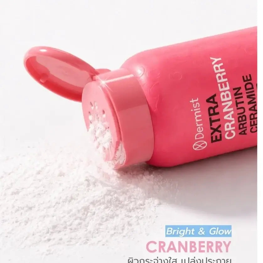 Dermist Cranberry Powder Extra Arbutin Ceramide in pink bottle, showcasing smooth matte texture for bright and glowing skin.