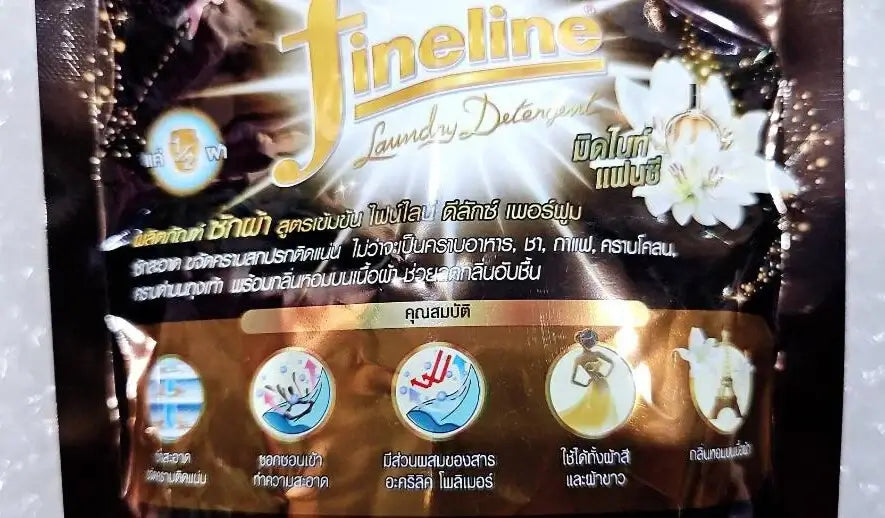 Close-up details on Fineline Laundry Detergent packaging highlighting the concentrated formula benefits and long-lasting freshness icons.