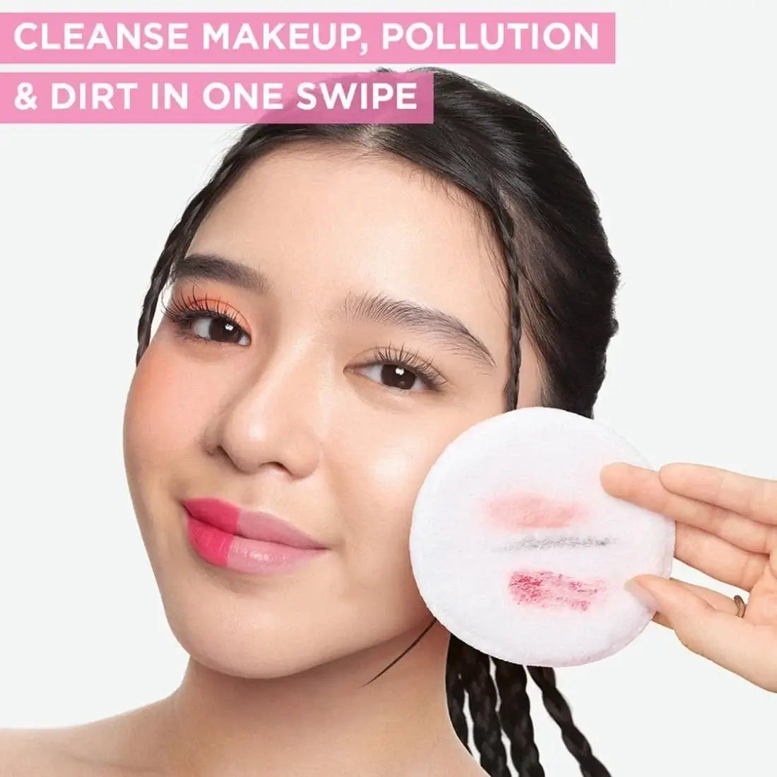 Garnier Micellar Water removes makeup and cleanses skin effortlessly with one swipe, demonstrated by a model holding a cotton pad.