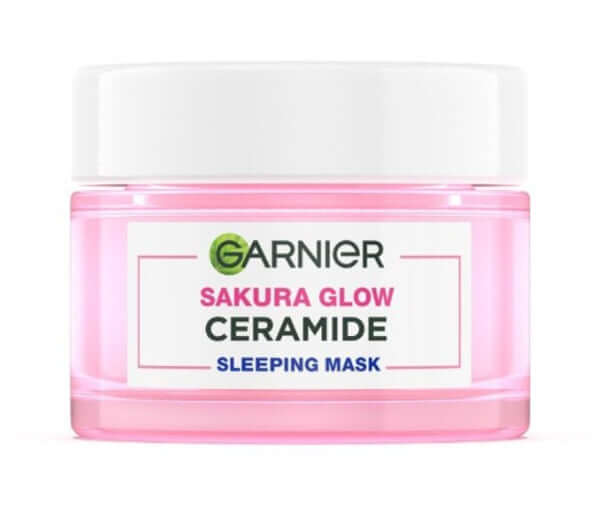 Garnier Sakura Glow Sleeping Mask Ceramide Night Cream in a pink jar for overnight skin hydration.