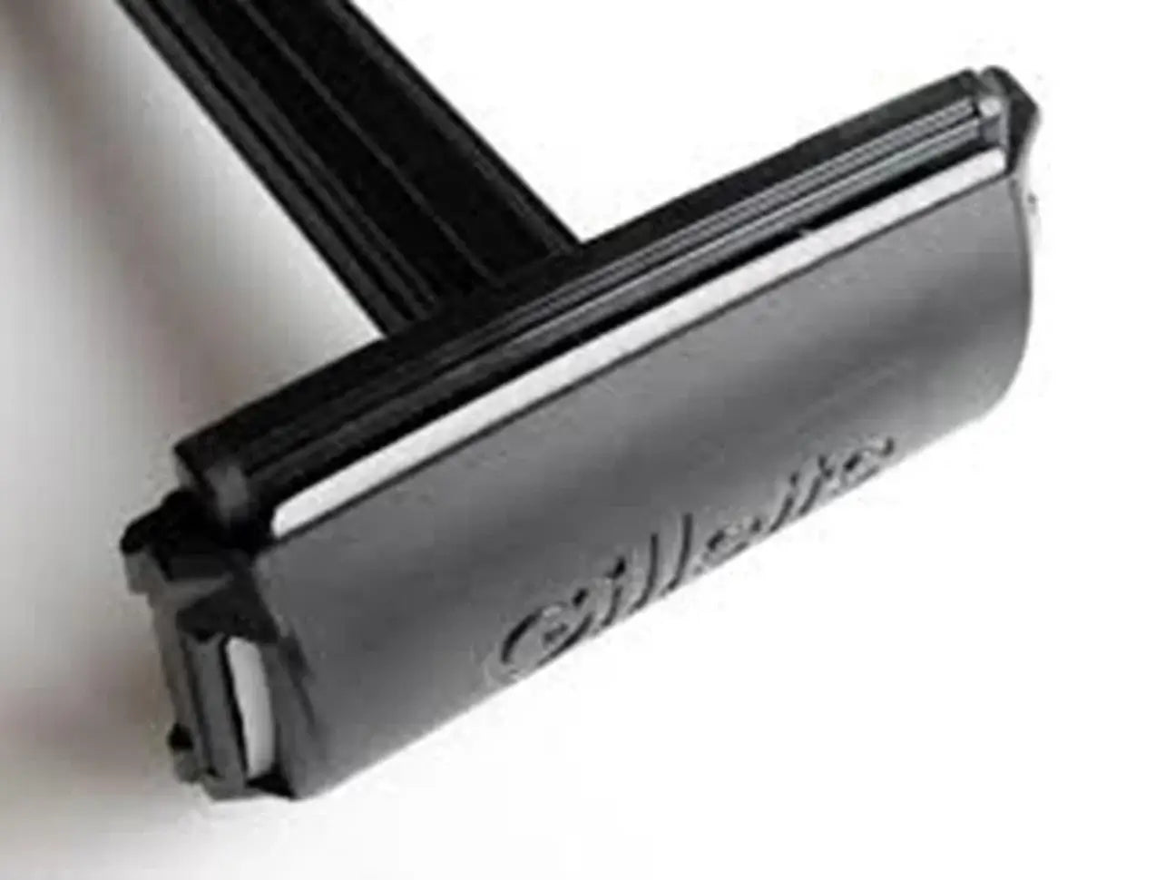 Gillette Super Thin double edge safety shaving razor blade close-up, featuring sleek black design for smooth shaving.