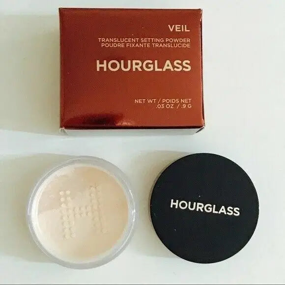 Hourglass Veil Setting Powder open jar displaying fine translucent powder alongside its box.