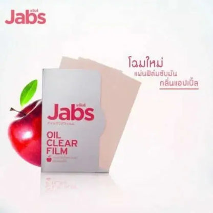 Jabs Oil Clear Film advertisement image, featuring product case, loose sheet, apple, and Thai text on a white reflective background.