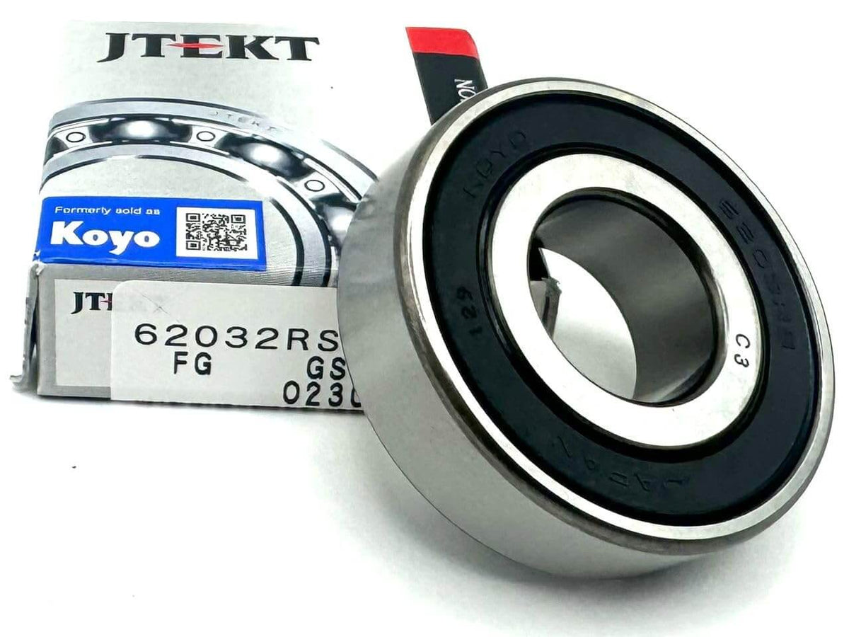 KOYO 6203-2RS Bearing displayed with packaging, highlighting deep groove ball bearing with rubber seal.