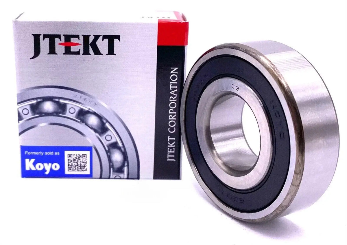 KOYO 6203-2RS Bearing displayed with JTEKT packaging, showcasing smooth rotation and rubber seal design.