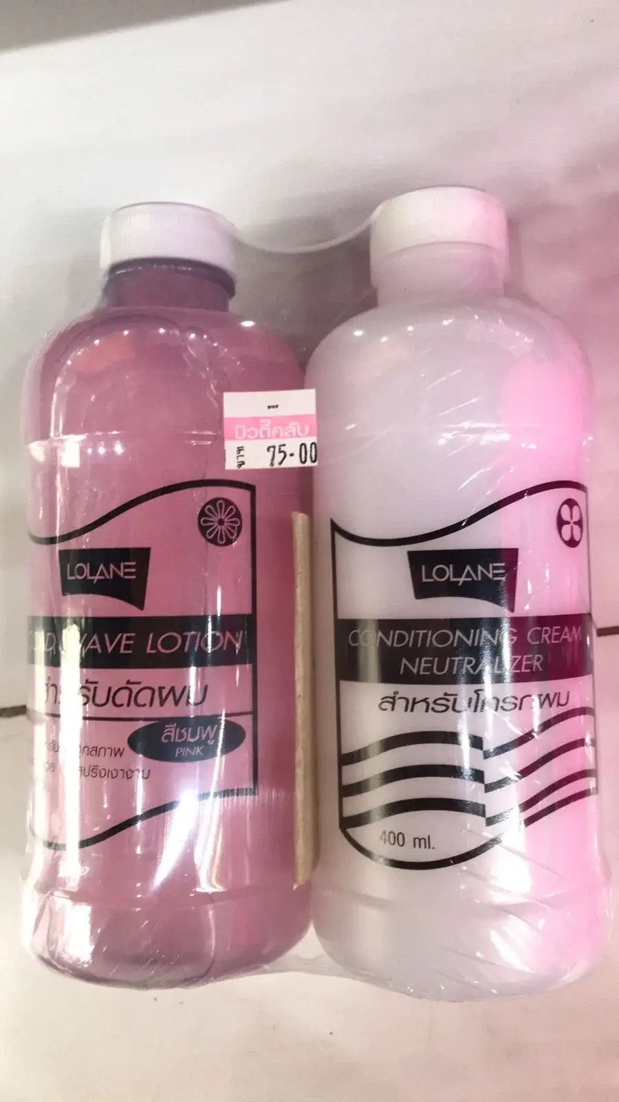 Lolane Cold Wave Lotion Perming kit with pink lotion and white conditioning cream, ideal for beautiful curls.