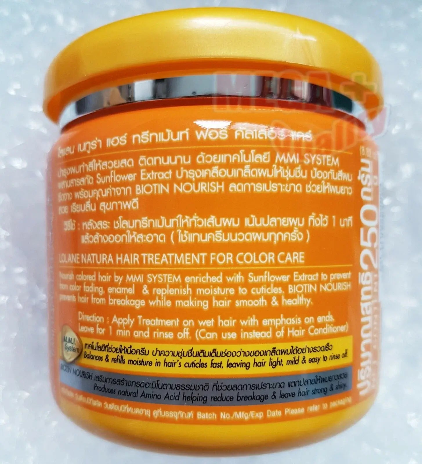 The back of a yellow jar of Lolane Natura Hair Treatment showing the detailed English product description, directions, and full ingredients list.