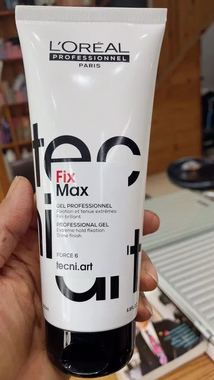 Hand holding Loreal Tecni Art Fix Max professional shaping gel tube