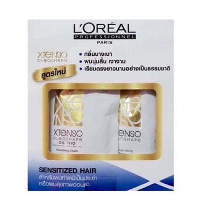 Loreal Xtenso Oleoshape permanent hair straightening kit packaging box for sensitized hair showing internal product pouches through a clear window.