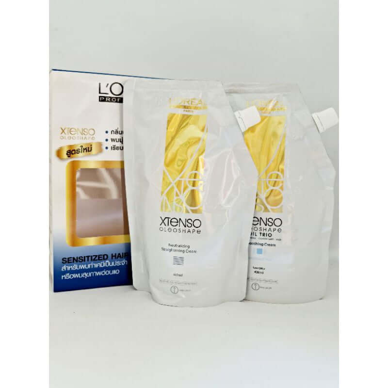Front view of the two Loreal Xtenso Oleoshape cream pouches with white and gold designs next to their original packaging box.
