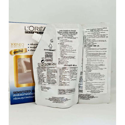 Back view of the Loreal Xtenso Oleoshape cream pouches showing detailed product instructions and safety warnings.