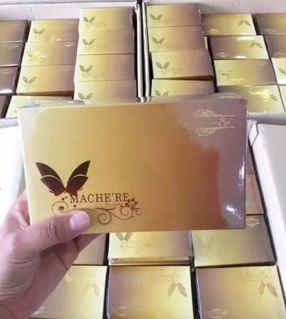 Machere Facial Skincare Set hand holding gold box in front of product stock
