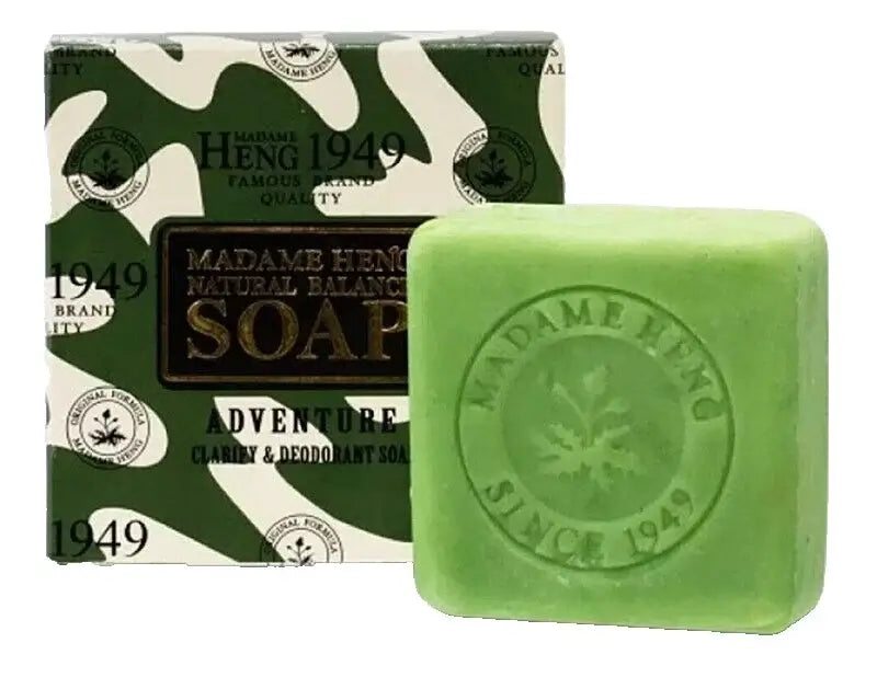 Green bar of Madame Heng Adventure Soap shown next to its product box.