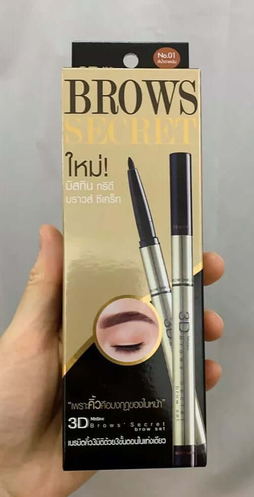 Hand holding Mistine 3D Brows Secret eyebrow pencil box packaging