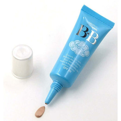 Mistine BB Baby Face Cream tube with the cap removed, dispensing a product droplet.